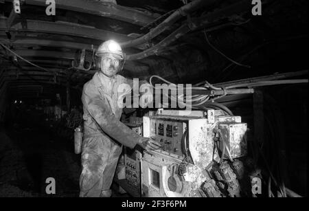 man working at the machinery on coal seam underground at Monkwearmouth Colliery Stock Photo