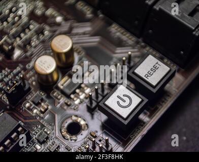 Close-up of power and reset buttons on a computer motherboard Stock Photo