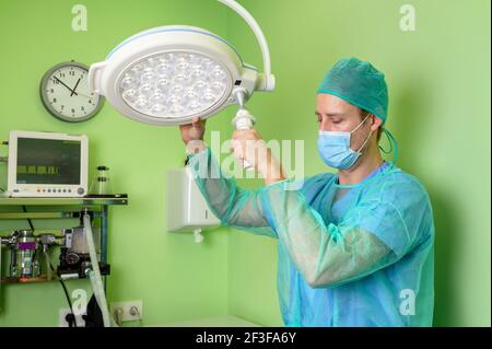 Male surgeon in operation room with protective workwear. High quality photo Stock Photo