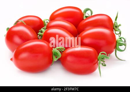Bunch of San Marzano tomatoes. Whole plum cherry juicy tomato isolated on white. Italian fresh vegetables. Organic raw vegan healthy food vegetable Stock Photo