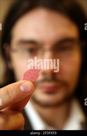 Jerome Taylor tries MIRACLE FRUIT ( Synsepalum Dulcificum) which makes sour and bitter foods taste sweeter.photograph by David Sandison The Independent Stock Photo