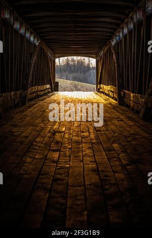 The inside of the Medora Covered bridge in Jackson County, IN as seen a few minutes before sunset one afternoon in early March.  This is looking East. Stock Photo