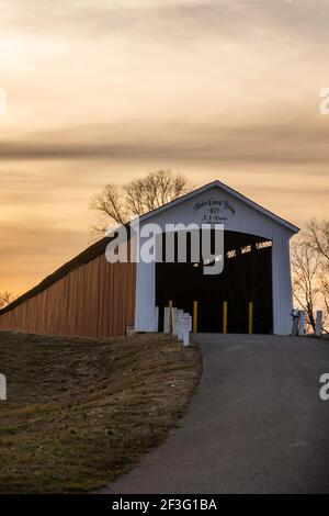 The East end of the Medora Covered bridge in Jackson County, IN looking west a few minutes before sunset on an overcast March afternoon. Stock Photo