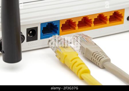 Wireless router with cables, isolated on white background Stock Photo