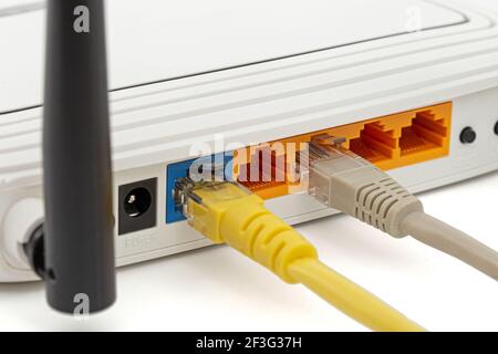 Wireless router with cables, isolated on white background Stock Photo