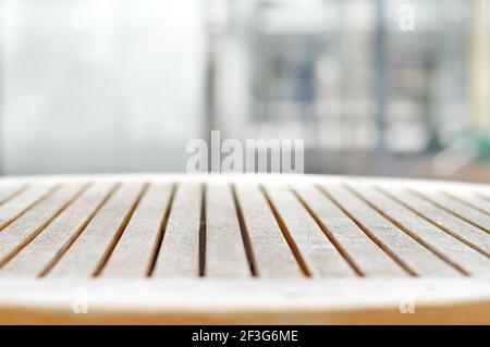 Round wood table top on blur background - can be used for display or montage your products Stock Photo