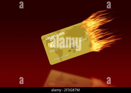 Golden credit card burning with trailing fire and copy space against red background. Concept of credit trouble, financial crisis, credit warning, debt Stock Photo