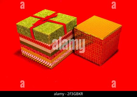 Two Christmas Gift Boxes On Red Background Stock Photo