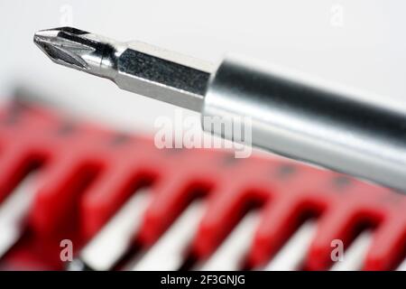 Screwdriver bits made from tool steel in the red box photographed against a white background in the studio Stock Photo