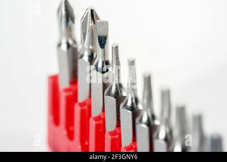 Screwdriver bits made from tool steel in the red box photographed against a white background in the studio Stock Photo