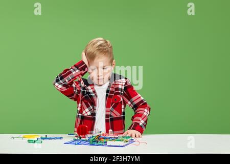 children playing with electronic constructor at studio Stock Photo