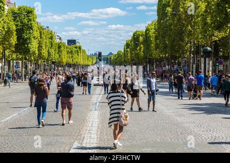 Paris- July 6,2017: People walking on the famous French boulevard Champs Elysees closed for car traffic. Each first Sunday of the month The Boulevard Stock Photo