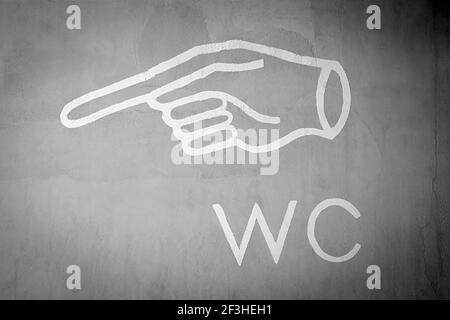 WC (water closet) or  toilet sign on the wall Stock Photo