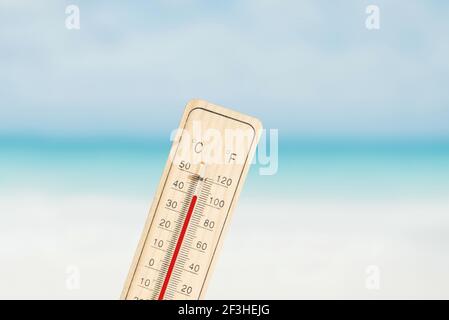 Thermometer displays warm sunny 25 degrees centigrade hi-res stock