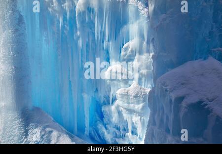 Frozen mountain waterfall with icicles texture close up Stock Photo