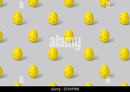Easter seamless pattern. Trendy yellow painted egg on grey background. Creative packaging design in the concept of minimalism Stock Photo