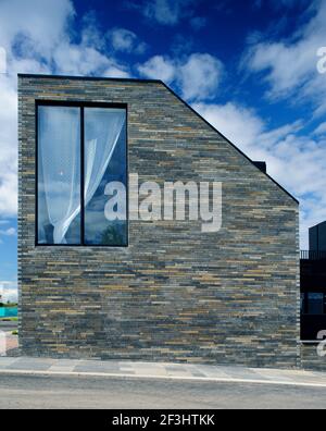 Scotland's Housing Expo.  The Stone House.  looking at the end wall and large window in the double height end of the terrace. NORD (www.nordarchitectu Stock Photo