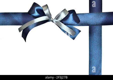 Beautiful blue silk ribbon and silver and blue bows for wrapping gift isolated on white background. Decorative bows for packaging present for any fest Stock Photo