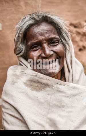 KOLKATA, INDIA - Nov 19, 2020: WEST BENGAL , INDIA MARCH 10 2021 : THE OLD GRAND MOTHER IS SMILING AT ME WHEN I ASKED TO TAKE A PICTURE . HER SMILE IS Stock Photo