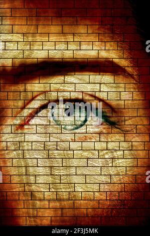 artistic composite of a woman eye and bricks wall Stock Photo