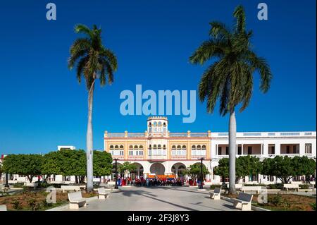 Moorish architecture of the town hall at the Parque CÃ©spedes, in front of it an event is just in preparation, Manzanillo, Cuba Stock Photo