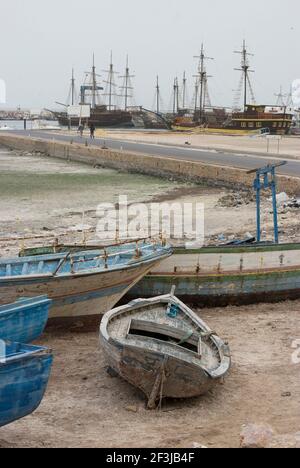 Boats resting on the shore and masts in the distance of the Marina at Houmt Souk, Island of Djerba, Tunisia | NONE | Stock Photo