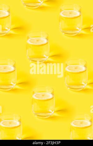 Yellow summer pattern with glasses of lemonade. Stock Photo