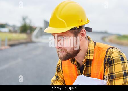 Workers as foremen when building a house during the planning on the construction site in the new development area Stock Photo