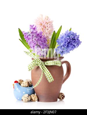 Easter greeting card with quail eggs and hyacinth flowers bouquet. Isolated on white background Stock Photo