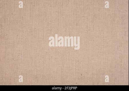linen fabric texture. Beige colored seamless linen texture or fabric canvas background. neutral textile texture, often used for furniture covers, pill Stock Photo