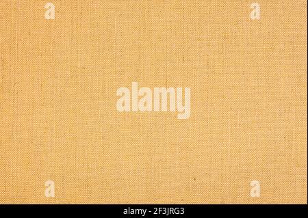 Fabric Background with clear Canvas Texture. Yellow colored seamless linen texture or fabric canvas background Stock Photo