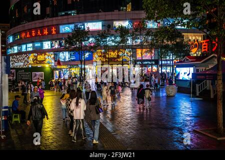 Kunming China , 3 October 2020 : People and shopping mall view at night in Nanping pedestrian street in Kunming Yunnan China Stock Photo