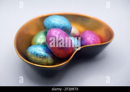 Chocolate Easter eggs in the lacquer bowl Stock Photo