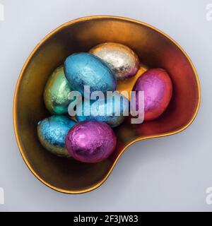 Chocolate Easter eggs in ceramic bowl Stock Photo
