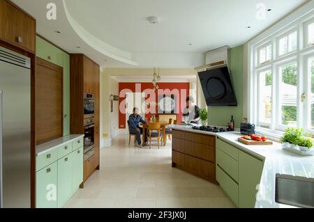 Contemporary Art Deco style walnut and mint Kitchen refurbishment Stock Photo