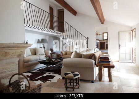 Wide shot of sitting room and stairs, looking towards kitchen , Villa in St Tropez Stock Photo
