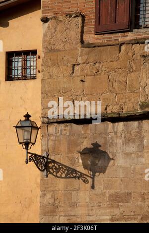 Lamp and shadow on exposed brick wall, Ponte Vecchio, Florence Stock Photo