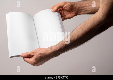 Opened book with blank pages isolated on gray background, editable mock-up series template ready for your design, pages selection path included. Stock Photo