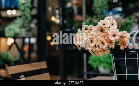 Cozy rustic vintage style in flower studio and organic cafe, outdoor interior, reopening after covid-19 pandemic Stock Photo