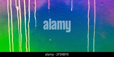 Blue green pink painter plastered wall background with colorful drips, flows, streaks of paint and paint sprays Stock Photo