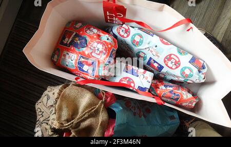 Top view of Christmas gift bag with wrapped presents Stock Photo
