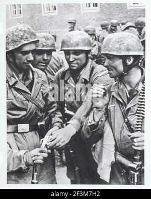 World War II period from German propaganda news. German paratroopers after battle durign Norwegian Campaign (Operation Weserübung). 1940 Stock Photo