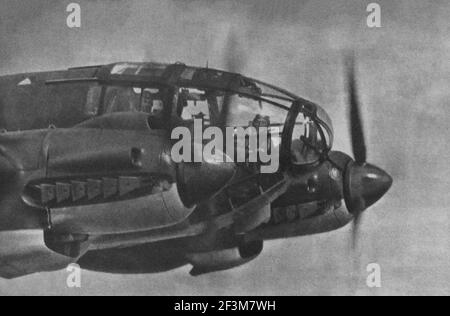 World War II period from German propaganda news. Balkans campaign. German Luftwaffe bomber. 1941 Stock Photo