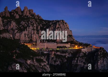 Montserrat and the Montserrat abbey at sunrise, from the Creu de Sant Miquel viewpoint (Barcelona province, Catalonia, Spain) Stock Photo