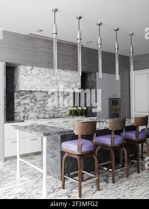 Stools in front of breakfast bar in grey marble kitchen in Bangkok apartment, Thailand Stock Photo