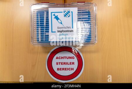 17 March 2021, Bavaria, Fürstenfeldbruck: Syringes with Biontech/Pfizer vaccine are in a special box with the inscription 'Bayerisches Impfzentrum - Landkreis Fürstenfeldbruck' in the laboratory of the Coronavirus - Impfzentrum Fürstenfeldbruck. In front of it is a sticker with the inscription 'Attention sterile area'. The center can continue vaccinating after especially second vaccinations with vaccine from Biontech/Pfizer are planned, so that the vaccination operation can continue. Photo: Peter Kneffel/dpa Stock Photo
