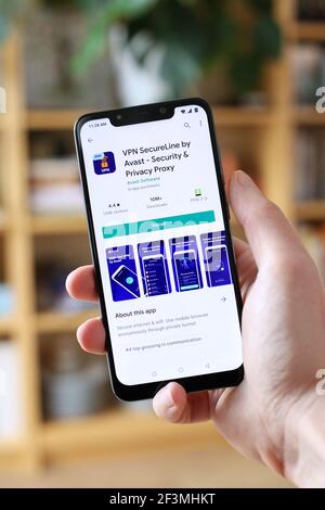 WARSAW, POLAND - JANUARY 29, 2021: User installing VPN SecureLine by Avast privacy app on an Android OS, Xiaomi brand smart phone. Stock Photo