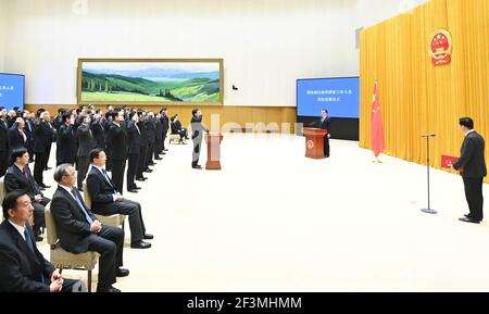 (210317) -- BEIJING, March 17, 2021 (Xinhua) -- Senior officials of departments and units under the State Council take an oath of allegiance to the Constitution at a ceremony in Beijing, capital of China, March 17, 2021. The ceremony was overseen by Premier Li Keqiang. (Xinhua/Li Xiang) Stock Photo