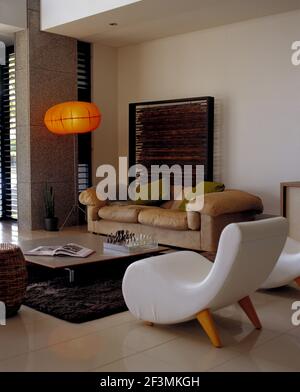 Seating around coffee table in modern living room, Australia Stock Photo