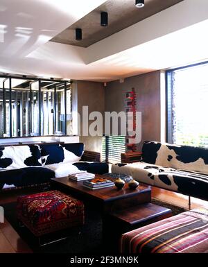 Seating around coffee table in modern sitting room, Bali Stock Photo